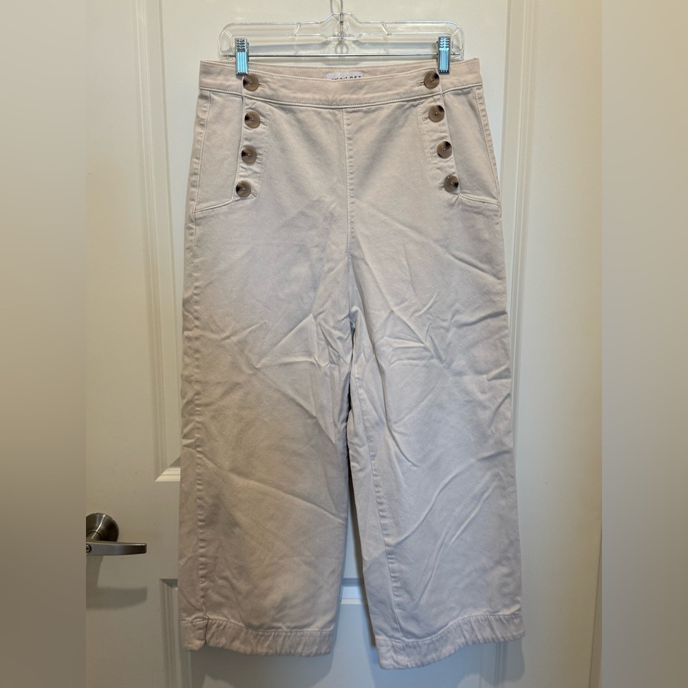 LOFT Cream wide leg, mariner style, button-accent trousers.